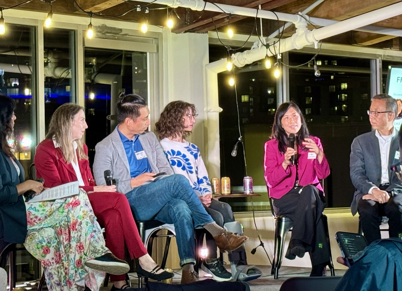 Panel discussion in progress at SeaHealthTech's From Promises to Proof event, AI House, Seattle.